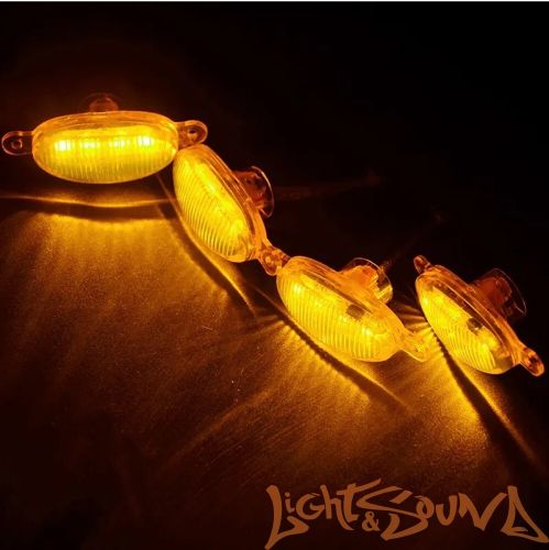 Ходовые габаритные огни в решетку радиатора черные (тонированные) овальные, оранжевый цвет 12В, 4шт